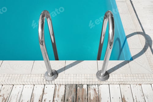 Preview: Modern swimming pool with ladder at resort