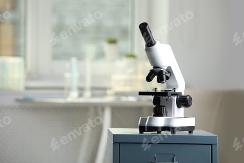 Preview: Modern medical microscope on drawer in laboratory, space for text