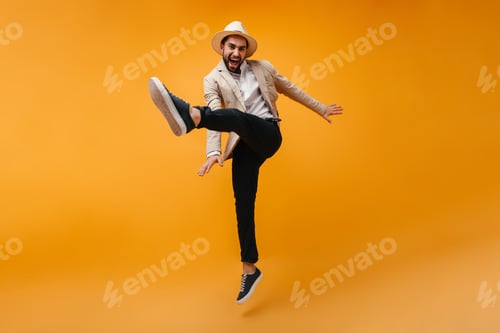 Preview: Cool man in great mood has fun on isolated background.