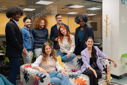 Preview: Diverse team in casual office attire, smiling together.