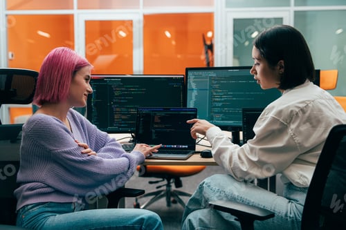 Preview: young programmers working on a new project for a start up business.