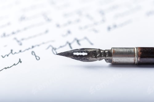 Preview: Writing with a fountain pen on paper with handwritten notes and words in black ink