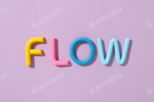 Preview: The word "flow" is laid out from colored plasticine on a purple background.