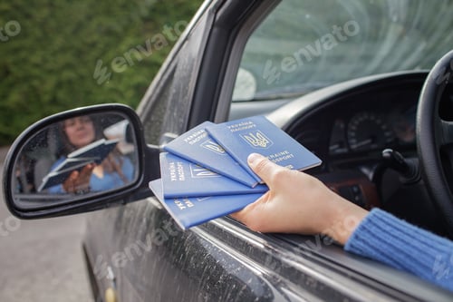Preview: Ukrainian refugees fleeing from the war. Mother shows passports at the boarder