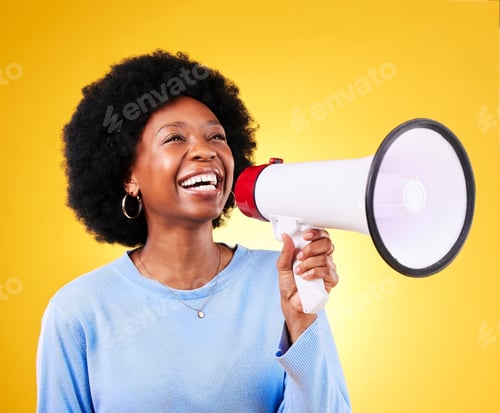 Preview: Happy black woman, megaphone and afro in promotion, advertising or marketing against a yellow studi