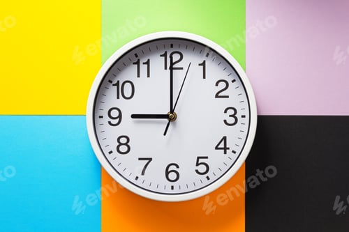 Preview: wall clock at abstract colorful paper