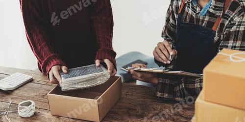 Preview: Young asian people couple Male and female small business owner checking online orders and packing
