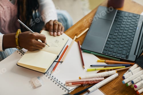 Preview: Writing Notes on Notepad at Work Desk with Laptop