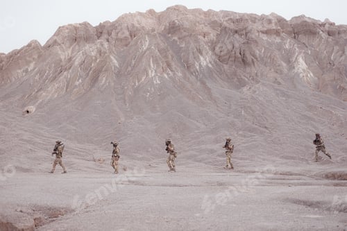 Preview: Soldiers in camouflage military uniforms carrying weapons Reconnaissance missions in rugged mountain
