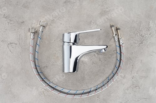 Preview: top view of water blender with flexible pipes on concrete surface