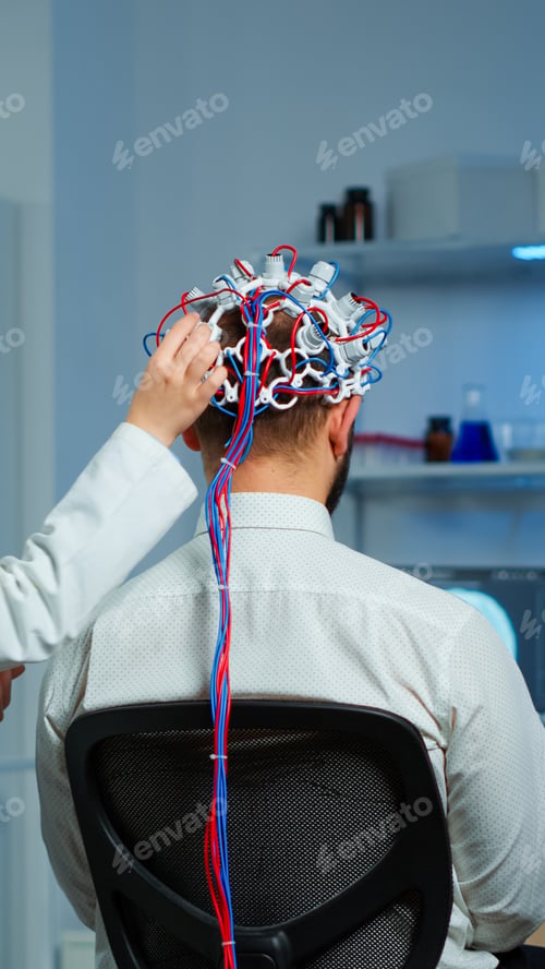 Preview: Back view of man wearing performant brainwave scanning headset