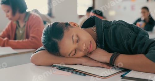 Preview: Exhausted, sleeping and student on desk in classroom at school with fatigue in lesson for learning.