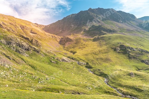 Preview: Beautiful mountain landscape sunset. Scenic view of a colorful sky above the mountains. Adventure