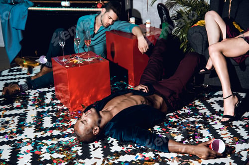 Preview: drunk sleeping man on floor after party