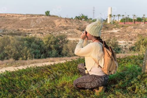 Preview: Beautiful shot of a female traveling and taking pictures outdoors