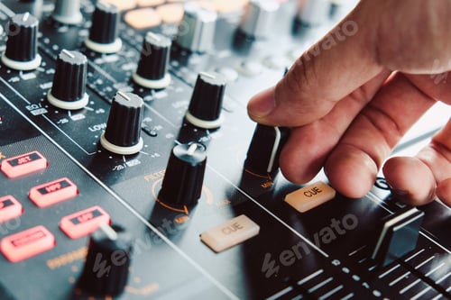 Preview: image of Dj playing music at mixer closeup