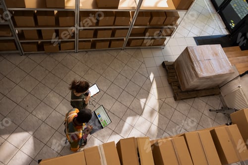 Preview: Diverse people overseeing inventory registration and packaging in depot