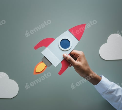 Preview: Hand holding rocketship startup business