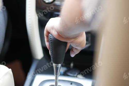 Preview: Male hand changing gear in the car,