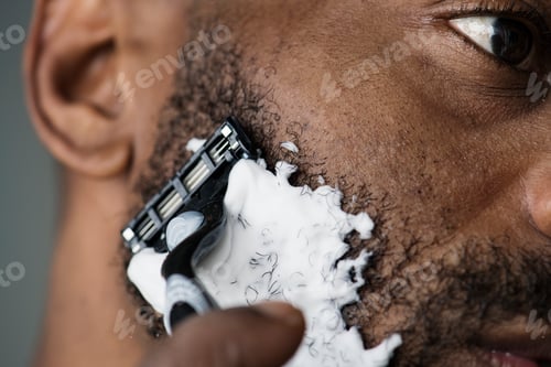 Preview: Black man shaving his beard