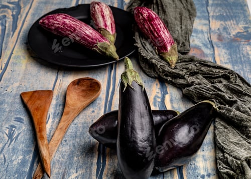 Preview: Ripe eggplants on shabby tabletop