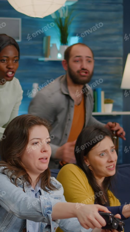 Preview: Afro american woman playing online videogames against man