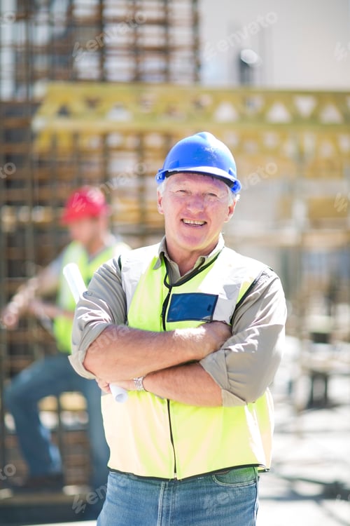 Preview: Portrait of smiling construction worker in construction site