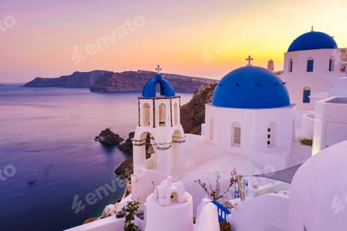 Preview: White churches an blue domes by the ocean of Oia Santorini Greece, traditional Greek village