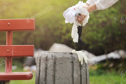 Preview: woman throws plastic garbage in the trash. woman hand picking up garbage plastic for cleaning