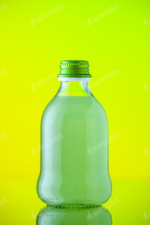 Preview: front view glass bottle with green juice on yellow background