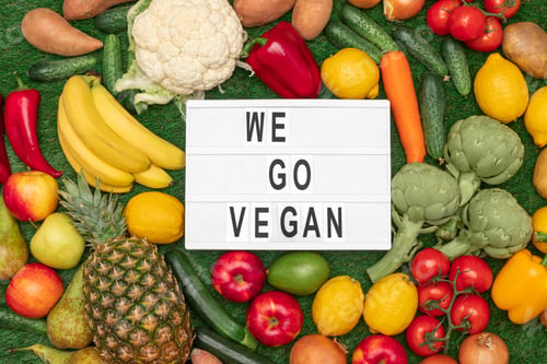Preview: Healthy food around board with writing