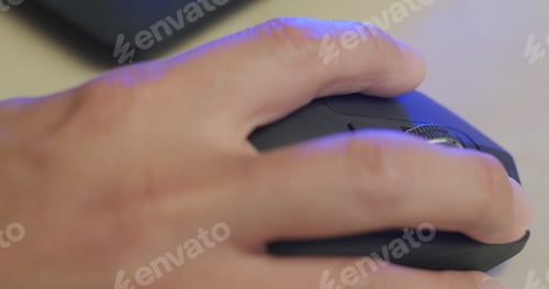 Preview: Man working on computer with using mouse