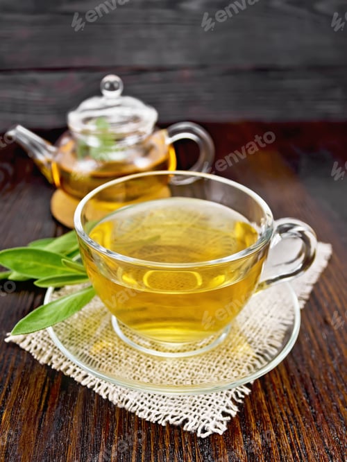 Preview: Tea herbal with sage in glass cup on napkin