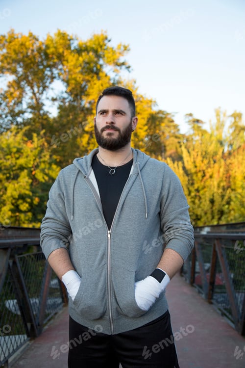 Preview: portrait of a bearded Caucasian man in sportswear outdoors