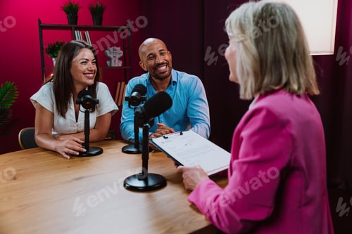 Preview: Content creators recording a podcast interview in studio