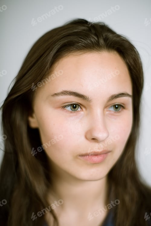 Preview: Portrait of a real young woman on a light background. Shallow depth of field. Focus on the eyelashes