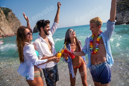 Preview: Traveling friends enjoying a beach day during their exotic vacation. Sunshine and cold drinks abroad