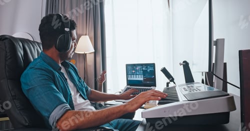 Preview: Asian musician is creating new music in his home studio.