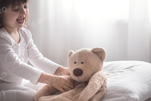 Preview: Little cute girl playing in bed , sleep concept