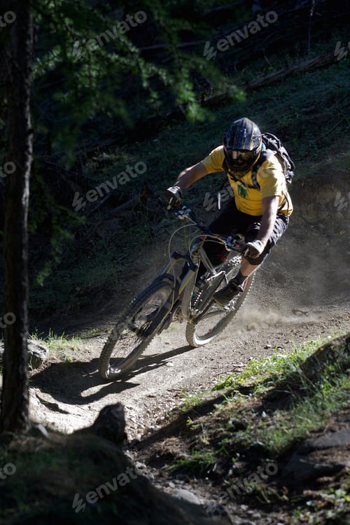 Preview: Mountain biker on dirt path