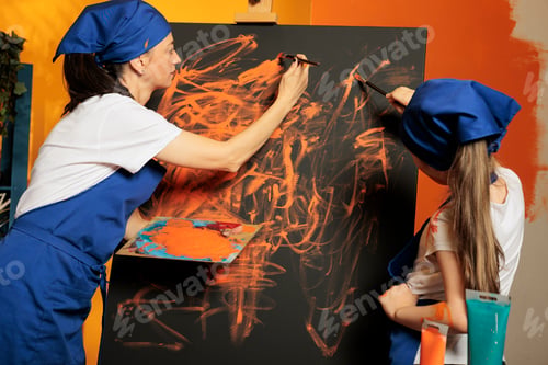 Preview: Mother with small kid creating masterpiece