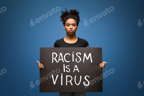 Preview: Black woman holding demonstration placard Racism is a Virus