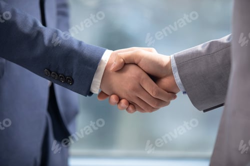 Preview: Successful Chinese businessmen shaking hands