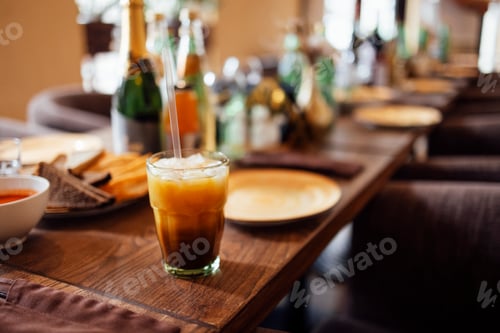 Preview: Coffee tonic with piece of orange and ice in glass