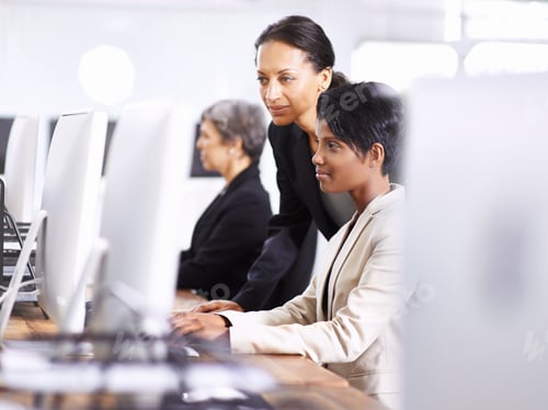 Preview: They have the best equipment for the job. Shot of three businesswomen working in an office.