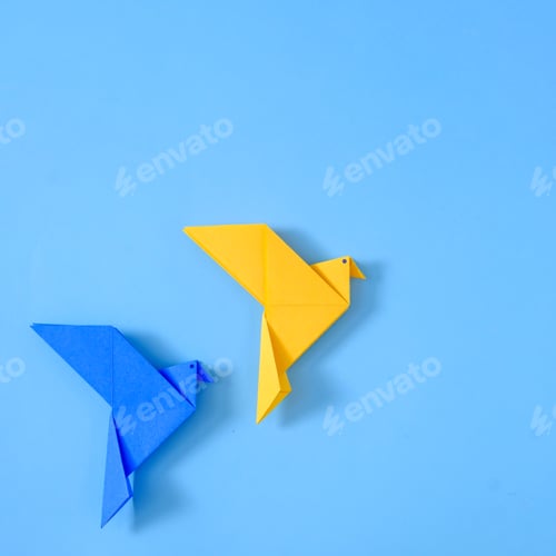 Preview: Two doves of peace on a blue background from a polygonal geometric toy.