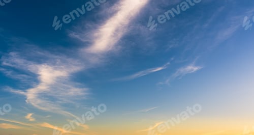 Preview: Sunset sky in the evening with orange sunlight clouds on blue sky, horizon sky nature background