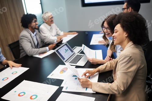 Preview: Group of successful business people at work in office