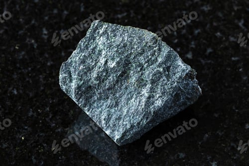 Preview: sample of peridotitic komatiite mineral on black