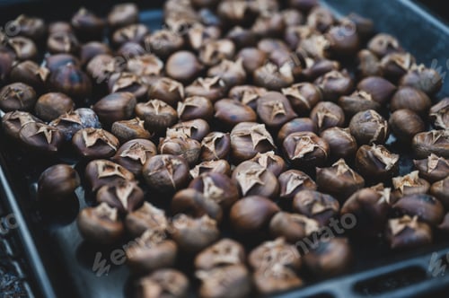 Preview: Chestnuts roasting on a tray
